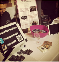 A wedding magician for hire stall at a Hampshire wedding fair. Booking a magician in surrey.